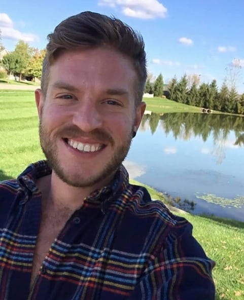 Headshot of male in front of lake