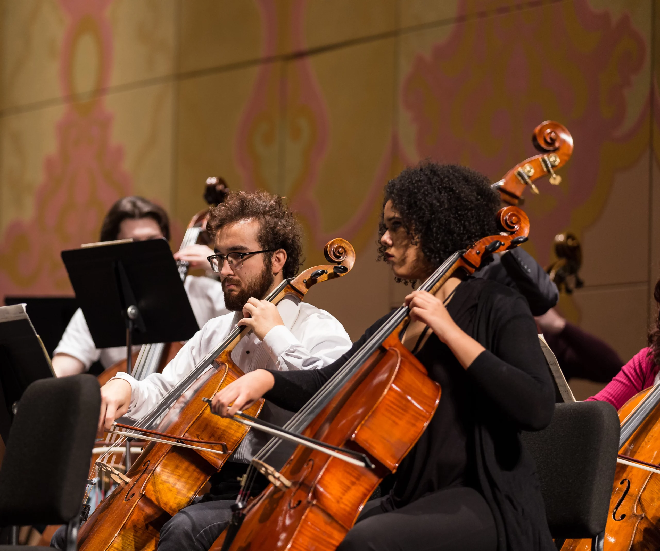 Students playing cello from orchestra performance