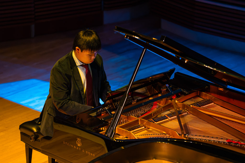 A photo of a student playing the piano.