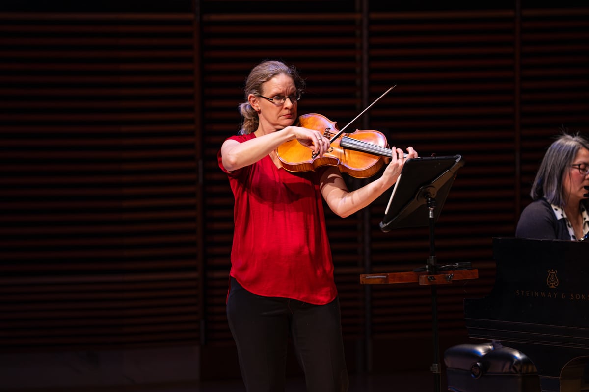 Hillary Herndon playing viola on stage