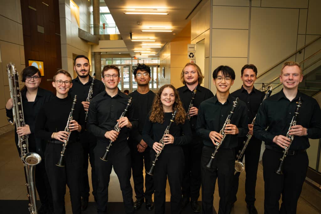 Group of students holding instruments posing.