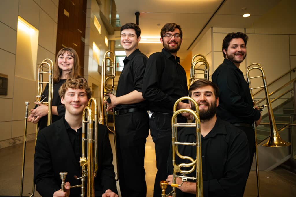Photo of a group of students holding their trombones.