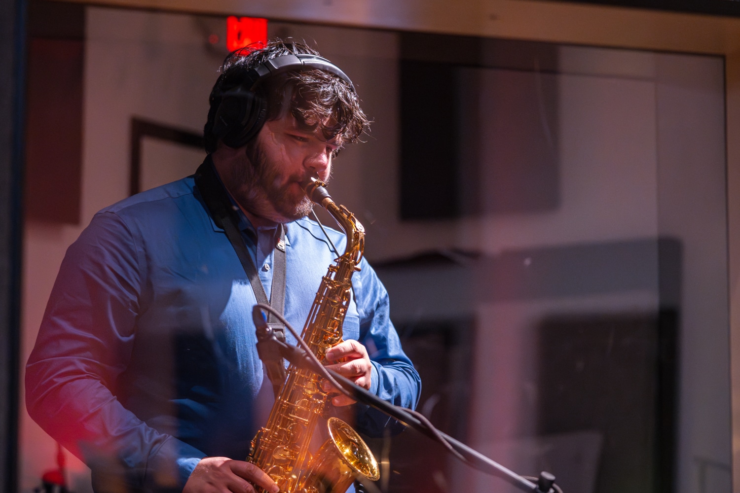 Man in studio playing saxophone