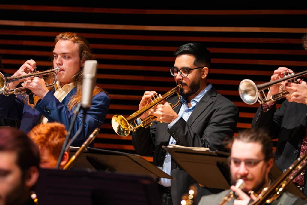 Group of students playing the trumpet.