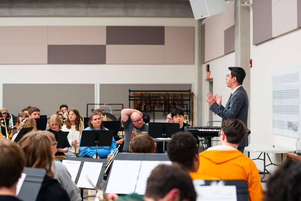 Photo of Professor Zanin standing in front of class teaching.
