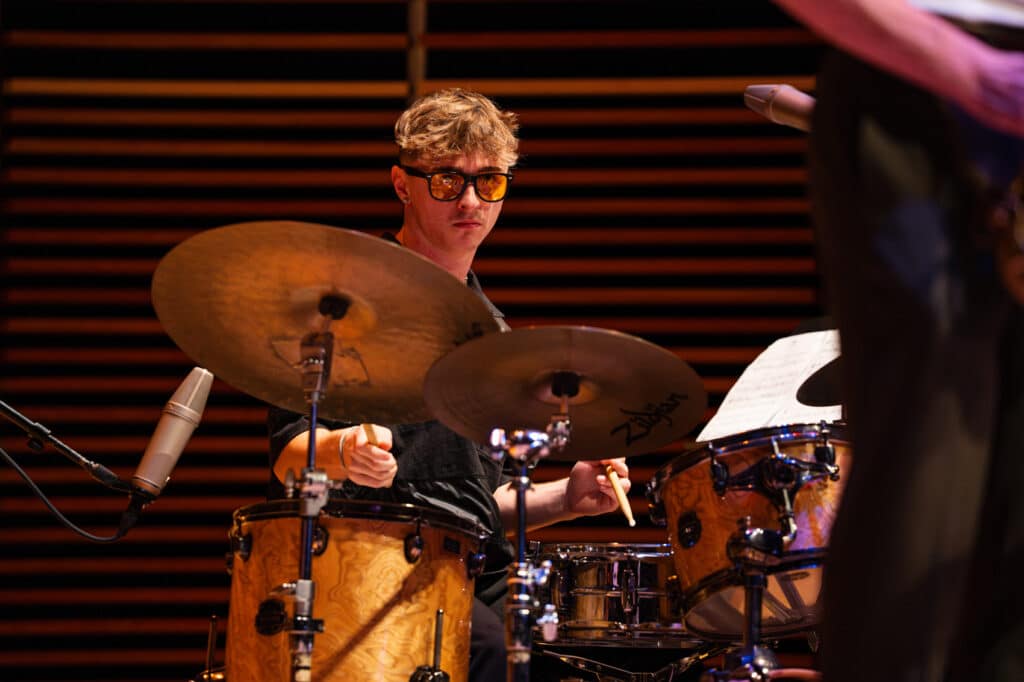Man playing the drums on stage