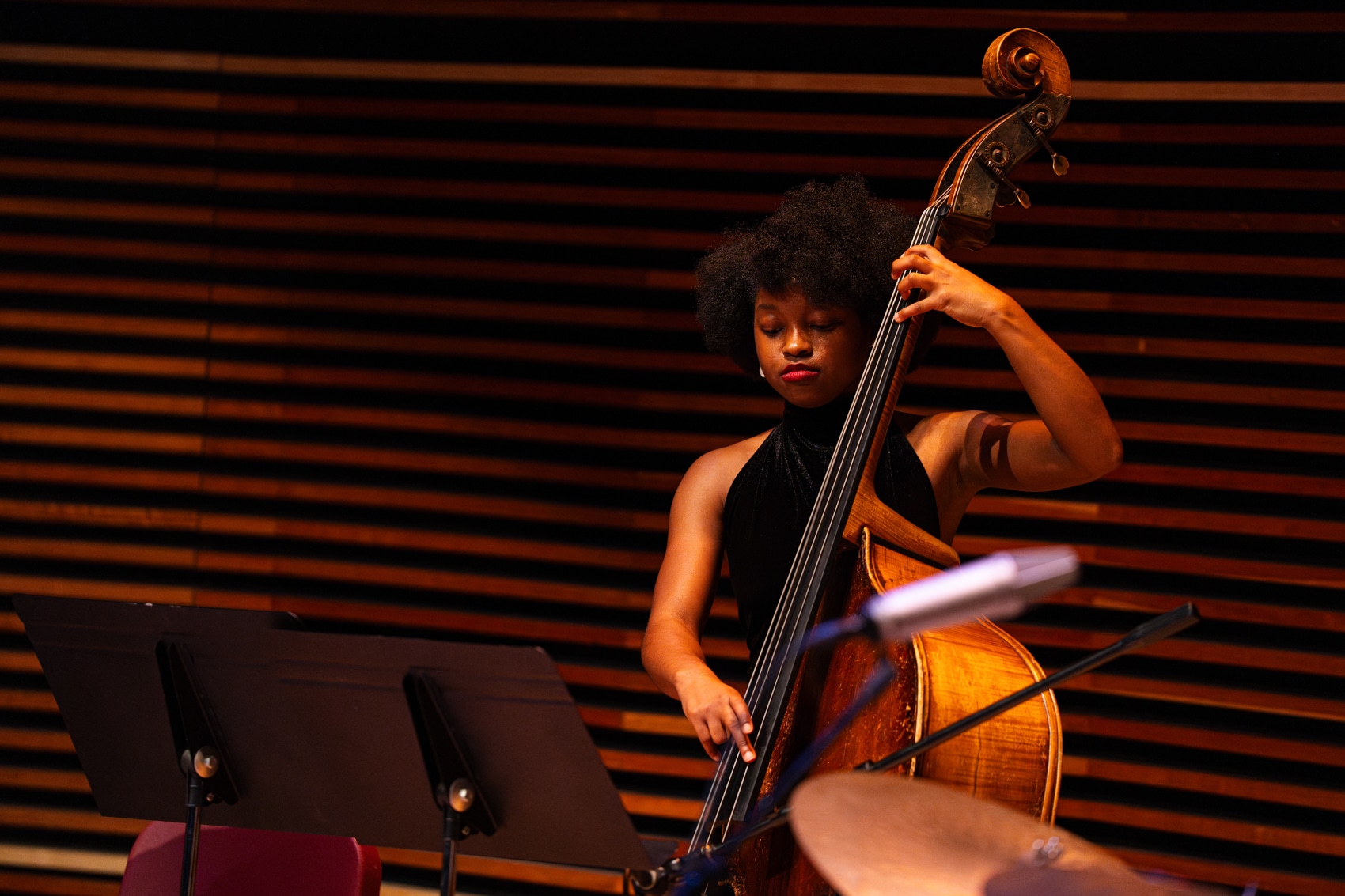 Female playing bass on stage
