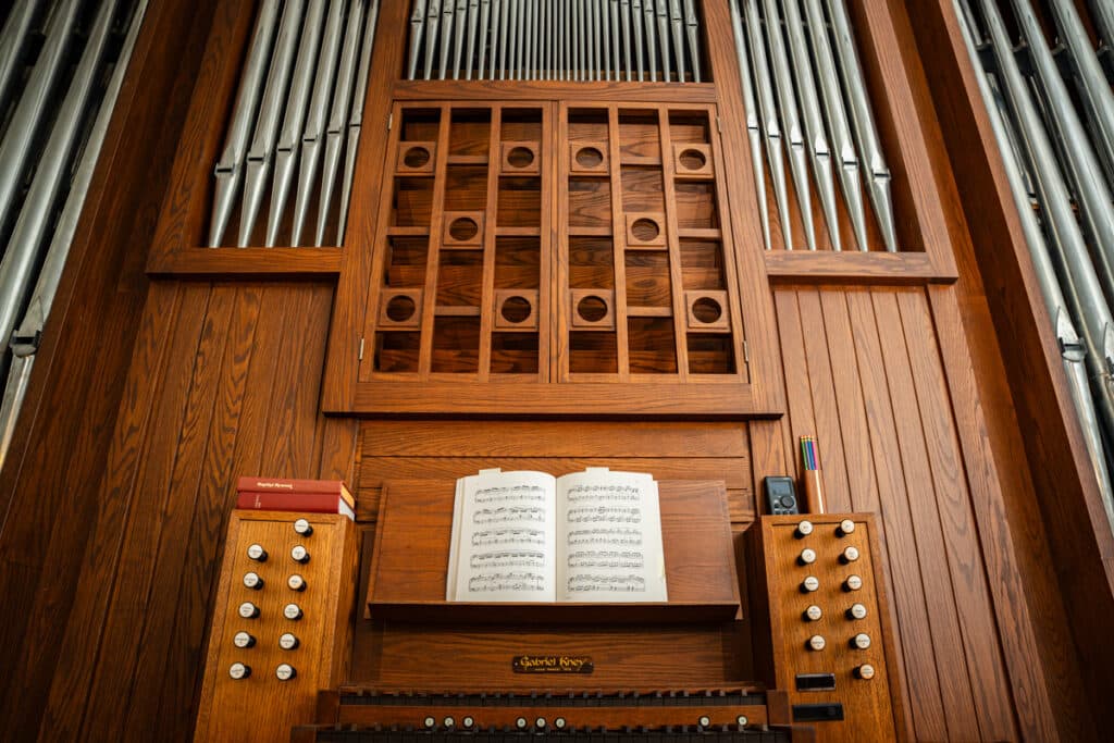 Organ with a book of sheet music above the keys