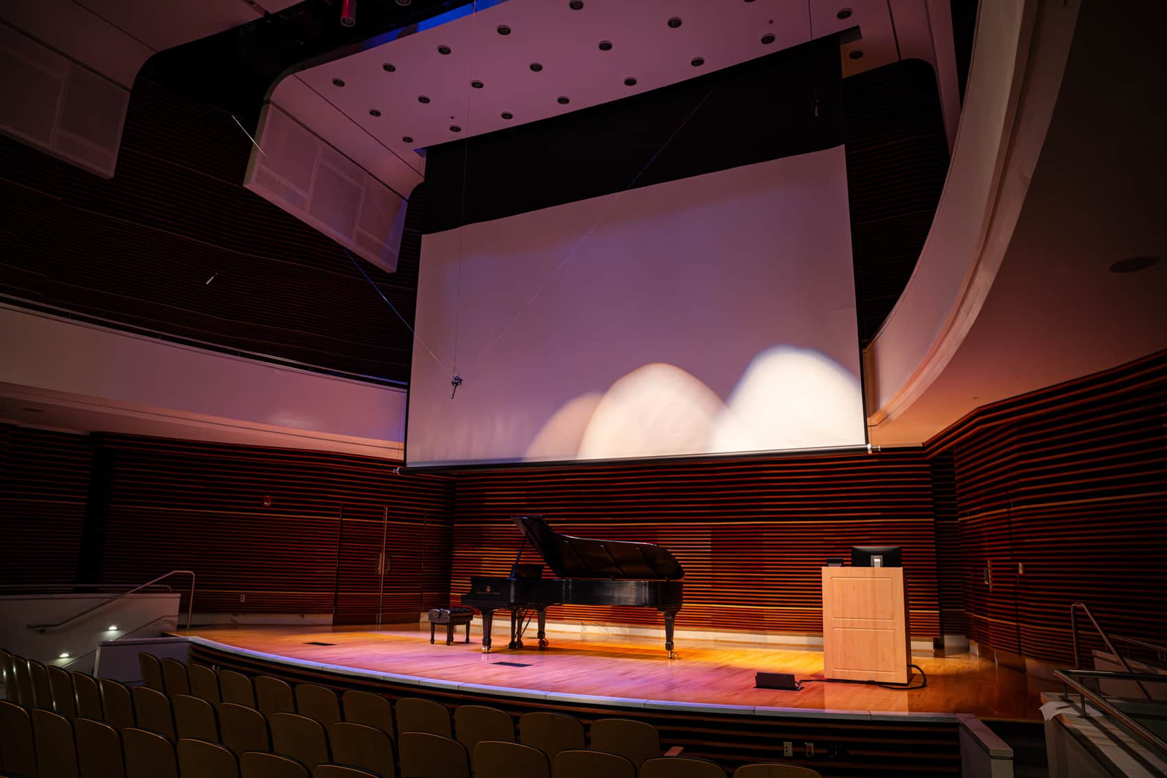 Close up of stage with piano on it