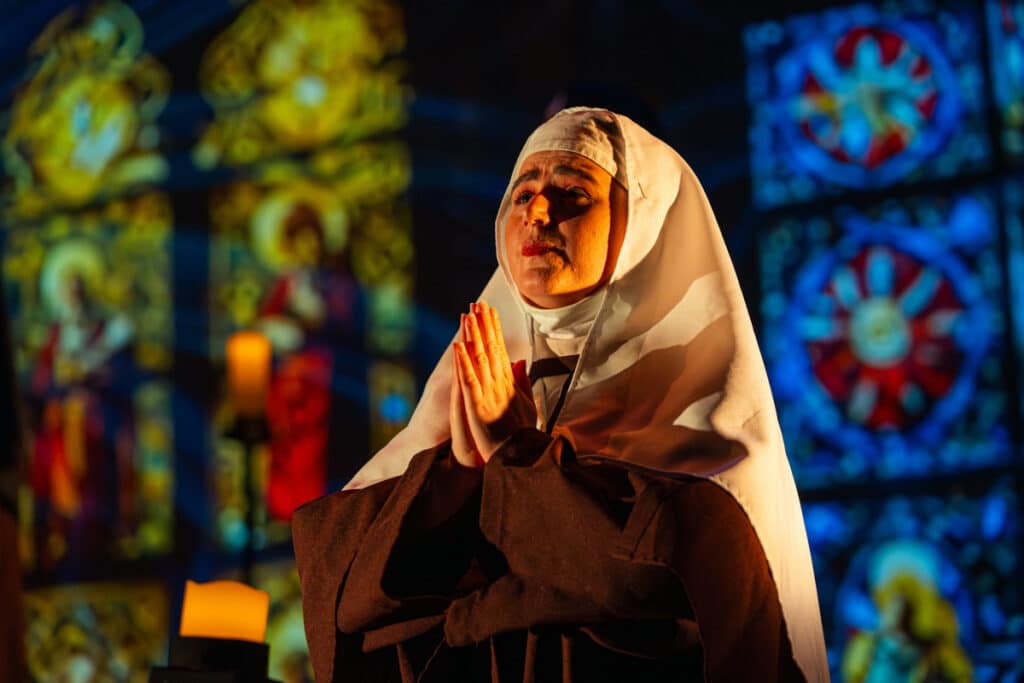 Female student dressed as a nun during an opera performance
