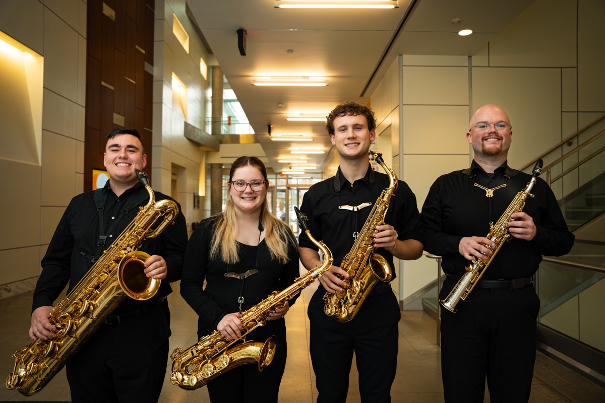 Group of saxophone players smiling