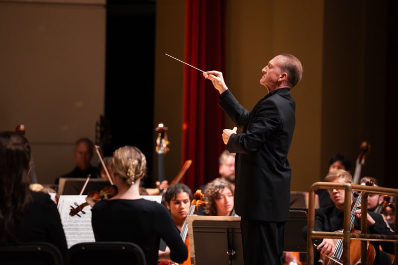 Conductor in front of symphony